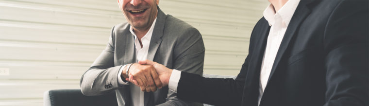 Colorado Insurance Broker Shaking Hands with a Man in Loveland, Fort Collins, Windsor, Longmont, Greeley