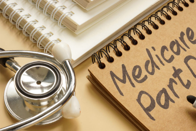 stethoscope and notepad with insurance information including Medicare Insurance in Fort Collins